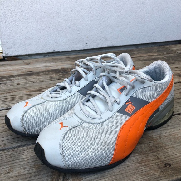 grey and orange puma shoes